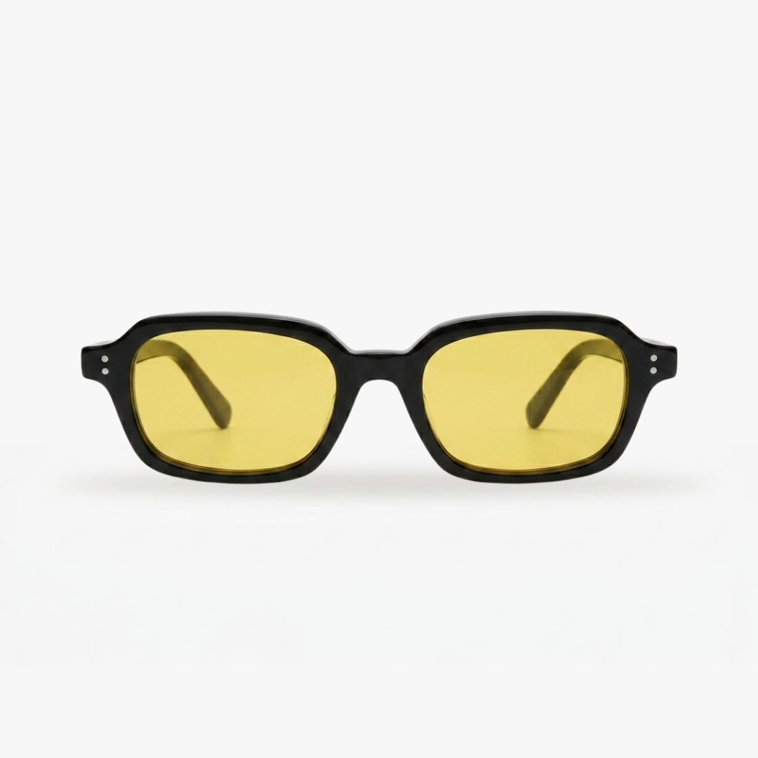 Sunglasses with black frame and yellow lenses on a white background