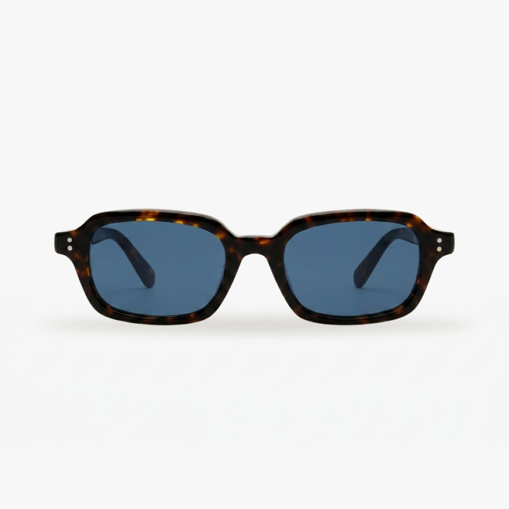 Sunglasses with tortoiseshell frame and blue lenses on a white background