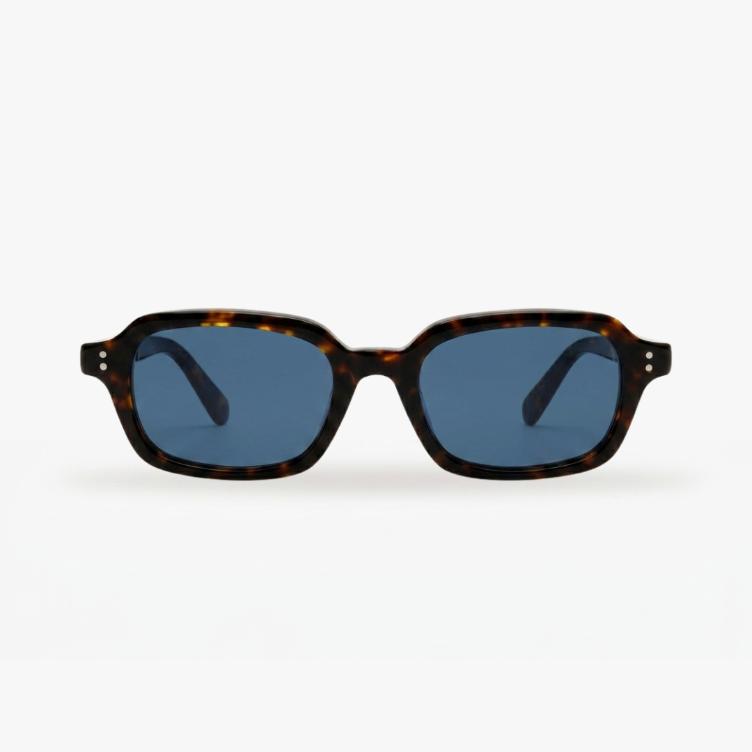 Sunglasses with tortoiseshell frame and blue lenses on a white background